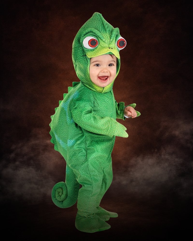 Infant wearing a premium Disney Pascal Halloween costume with green chameleon hood and curled tail
