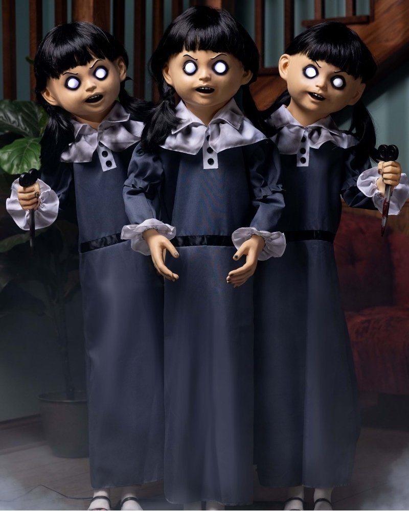 Evil triplets animatronic Halloween decoration with glowing eyes