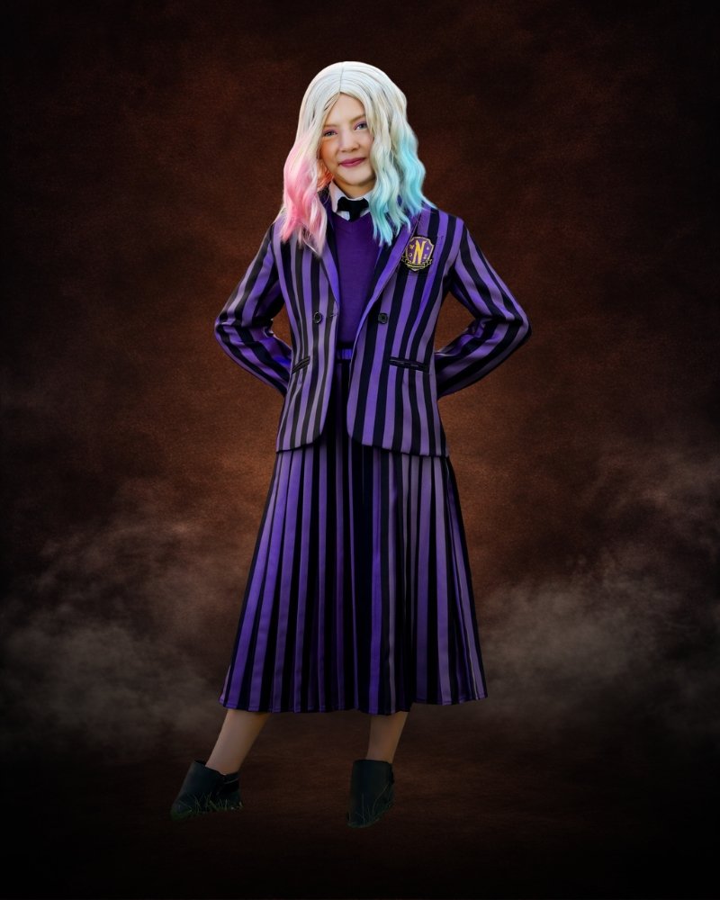 Deluxe Enid Sinclair Wednesday costume for girls with purple striped blazer, pleated skirt, and Nevermore Academy styling