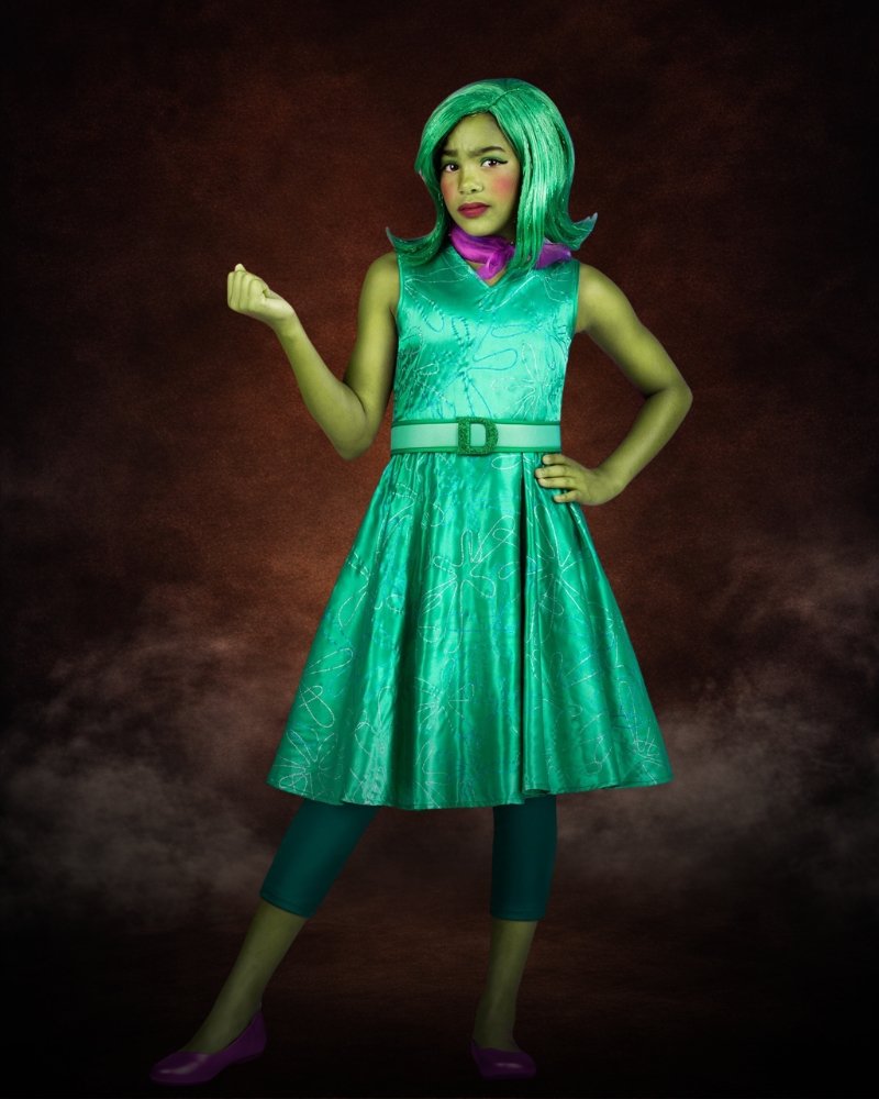 Disney and Pixar Inside Out Disgust costume for girls with green dress, matching wig, and character-inspired styling