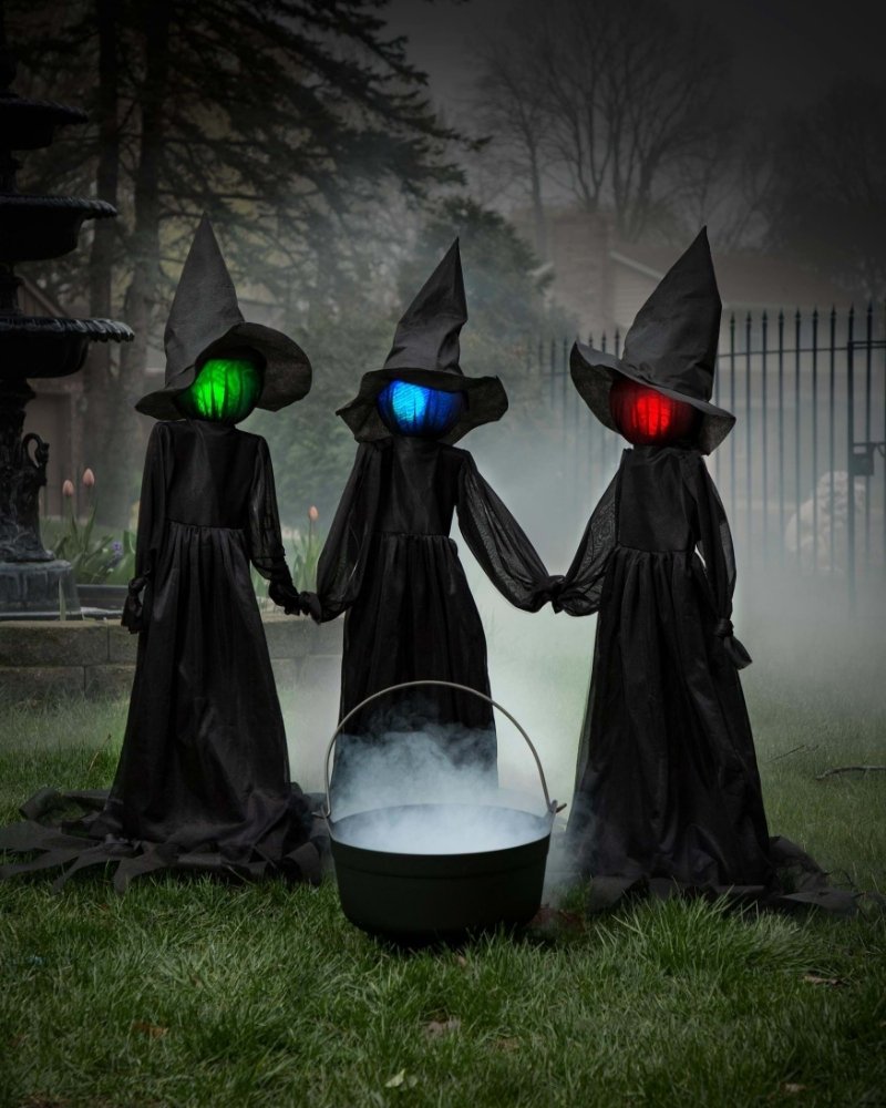 Holding hands witch sisters Halloween decoration set with glowing colored heads