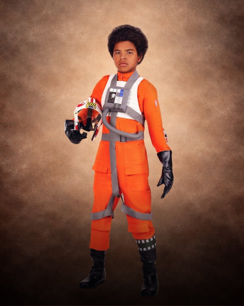 Boy's Deluxe Star Wars X-Wing Pilot Costume with orange flight suit, pilot harness, chest control box, gloves, and pilot mask.