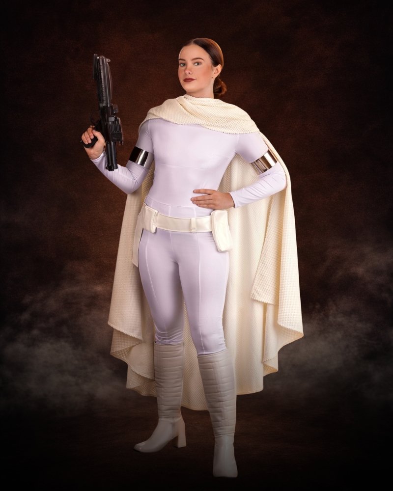 Deluxe Star Wars Padmé Costume for Women, fitted stretch jumpsuit with faux leather belt, shin guards, silver armbands and textured cape