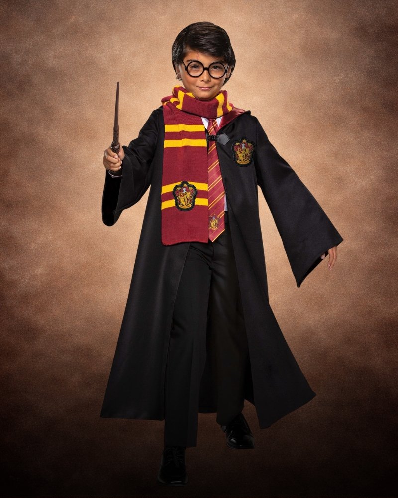 Harry Potter Trunk Costume Kit for Boys with Gryffindor robe, red and gold scarf, wand, glasses, and Hogwarts-inspired accessories.