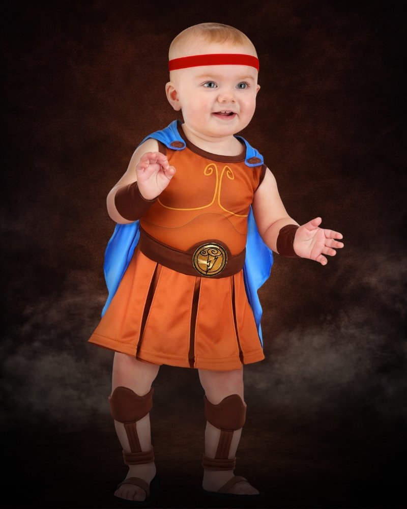 Infant Disney Hercules baby costume with blue cape, red headband, tunic dress and heroic Greek-inspired details.