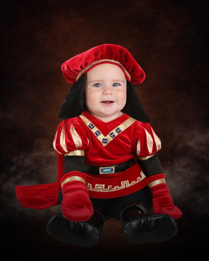 Infant Lord Farquaad Shrek costume with red velour tunic, gold trim, black hair hat, cape, mittens, and booties