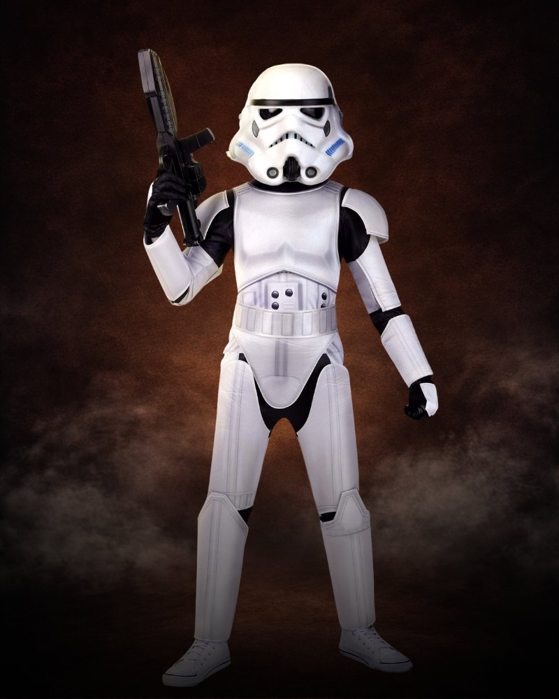 Boys Deluxe Star Wars Stormtrooper Costume with white armor graphics, foam mask, jersey jumpsuit, and Imperial military styling.