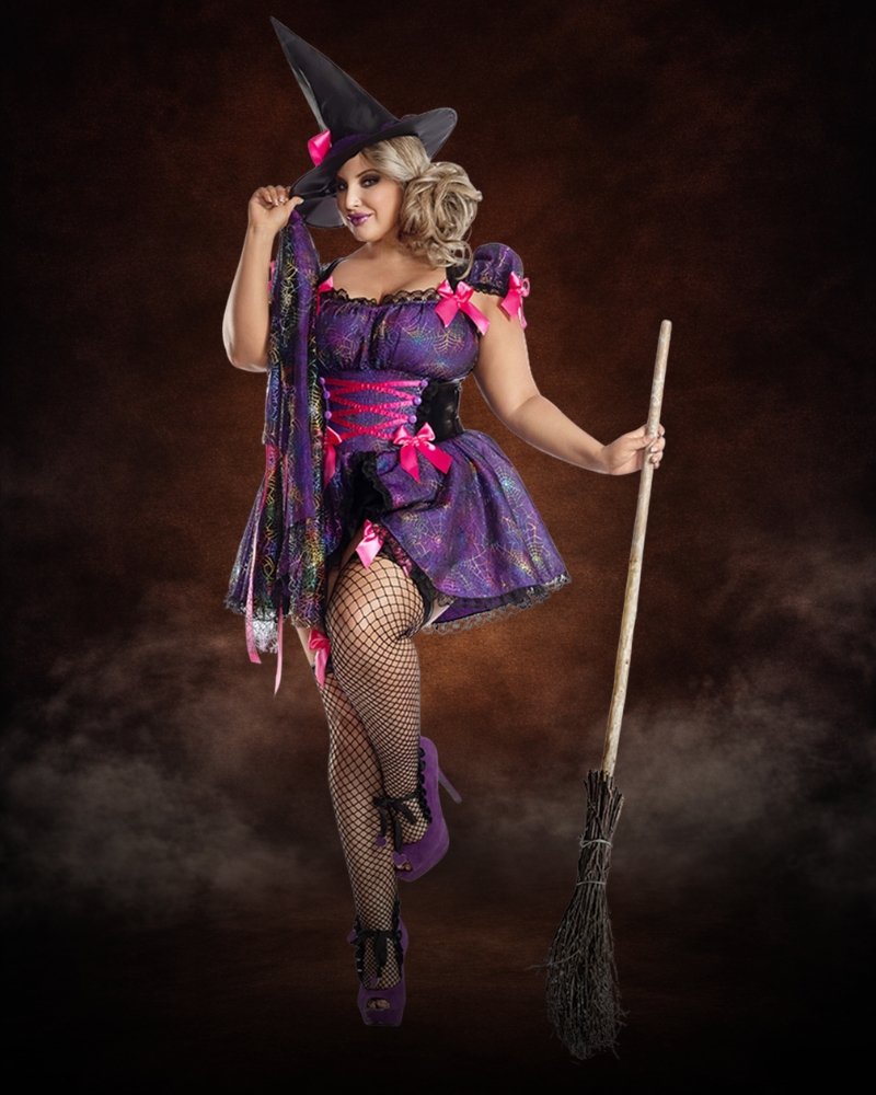 Plus Size Women's Purple Web Witch Costume with purple spiderweb dress, pink bows, lace trim, and matching witch hat