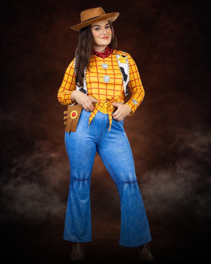 Women's Deluxe Pixar Toy Story Woody Costume, yellow western shirt, cow-print vest, blue pants with fringe, sheriff badge, scarf and cowboy hat