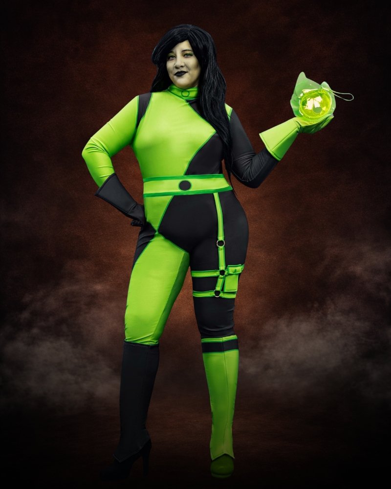 Women's Plus Size Disney Kim Possible Authentic Shego Costume with neon green and black jumpsuit, utility belt, harness, gloves, and boot covers