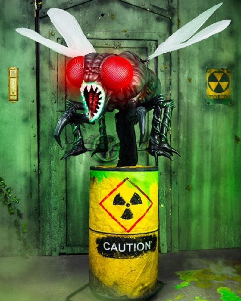 Mungo mutant fly Halloween animatronic with huge compound eyes, glowing red eyes, jagged teeth, wings and toxic waste barrel
